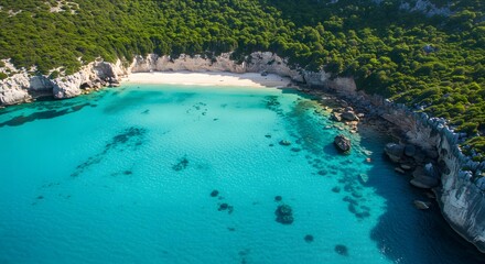 Aerial landscape of tropical cove with crystal clear sea and green cliffs