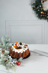 Christmas Holiday Bundt Cake with Icing and Cranberries on light background