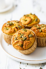 pumpkin muffins on a light background on a plate