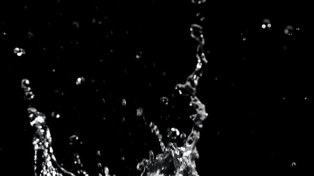 Splashes of water on a black background. Filmed on a high-speed camera at 1000 fps. High quality FullHD footage