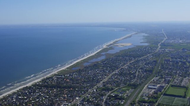 Aerial image of coastline and farm land in rural Denmark.