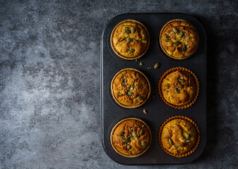 pumpkin muffins on a dark background