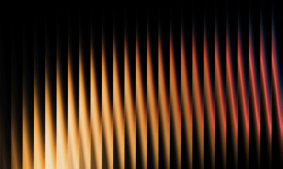 Abstract warm color streaks of light create a visually captivating textured background