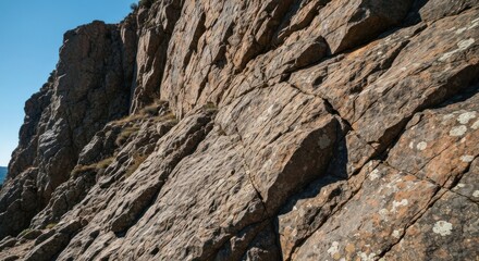 Close-up view of rugged, layered rock face