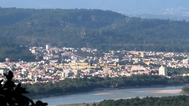 Haridwar cityscape seen from the premises of Chandi Devi Temple, Haridwar, Uttarakhand, India | The river Ganges (Ganga) is also seen