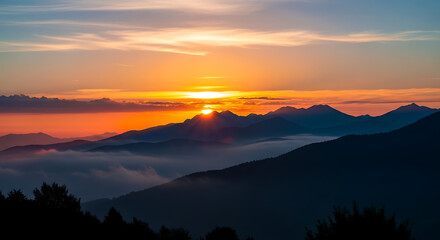 Obraz premium Golden Hour Sunset over Layered Mountains with Mist and Dramatic Sky