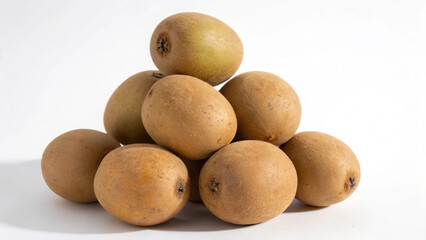 A pyramid of fresh sapodilla fruits isolated on white background, showcasing their natural brown color and smooth texture for healthy eating