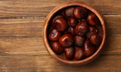 a bowl of raw chestnuts, top view