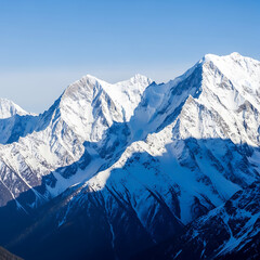 Snow capped Mountains and Icy Peaks Under a Clear Blue Sky