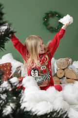 Festive children portrait — Cute blonde girl in red Christmas outfit —New Year holiday...