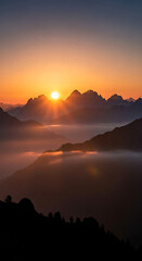Golden Sunrise over Layered Mountain Range with Misty Valleys