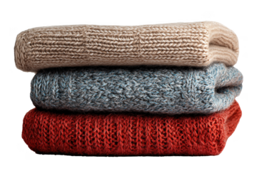 Stack of three folded knitted fabric items in beige blue and red isolated on a transparent background