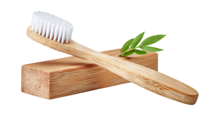Eco-friendly bamboo toothbrush resting on a wooden block with green leaves, showcasing sustainable dental care and natural materials for a healthier lifestyle