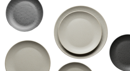 Set of ceramic plates in neutral grey, beige, and black tones with a matte finish, perfect for minimalistic kitchen or dining decor