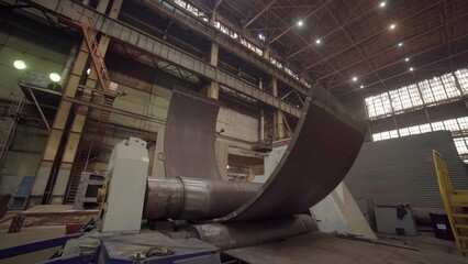 Industrial bending machine shaping metal sheet in factory. Stock clip