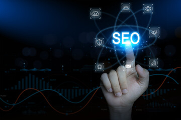  Hand touching SEO icon on digital interface, concept of search engine optimization and marketing
