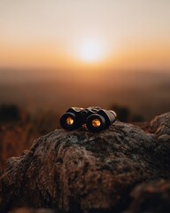 Binoculars on Rock at Sunset