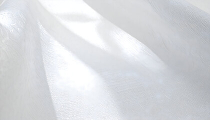 Translucent White Fabric Flowing Gracefully with Soft Light Reflections Creating an Ethereal Atmosphere