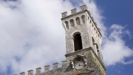 Majestic medieval clock tower reaching for the sky. Action