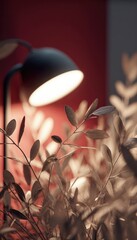 A muted-toned close-up shows a desk lamp's warm light illuminating muted-green foliage against a deep red wall. The focus is soft, emphasizing the lamp's glow and plant textures