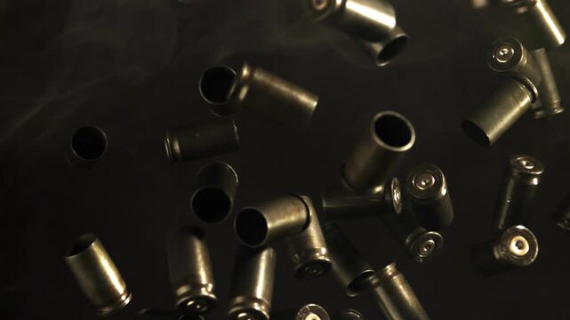 Bullet casings fly up and fall. Filmed on a high-speed camera at 1000 fps. High quality FullHD footage