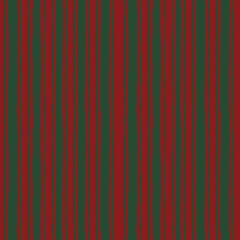 Obraz premium Seamless Christmas striped pattern in red and green. Perfect for festive wrapping paper, textile design, packaging, backgrounds, and holiday decor. Classic, cozy, and timeless winter style.