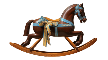 A brown rocking horse decorated with blue and yellow ribbon standing as a vintage toy display on white background