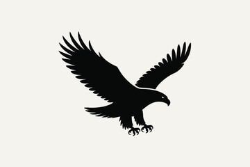 Silhouette of a powerful eagle in flight with wings spread wide