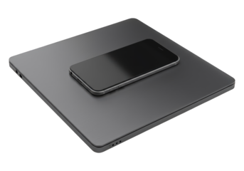 Modern technology devices, a laptop and a smartphone, rest together.