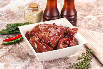 Raw uncokked chicken liver in the bowl