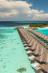 Amazing aerial travel landscape summer tropical luxury resort. Best vacation top destination Maldives water villas paradise island. Beautiful drone sunny sea sky gorgeous nature serene tranquil view