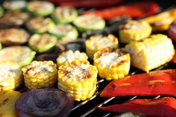 Vegetarian barbeque. Many different cooked vegetables on grill, closeup