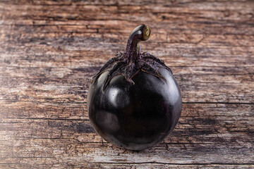 Raw round black big eggplant