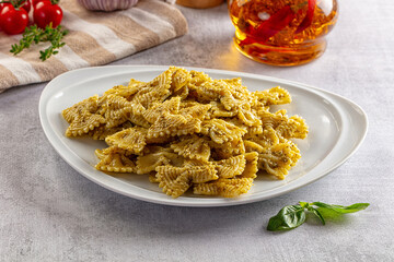 Italian green pasta farfalle with pesto