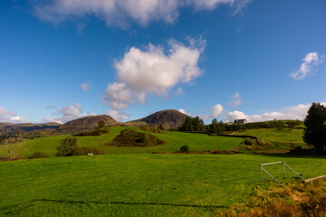 Fototapeta premium Green Hills and Countryside View with Distant Mountains, Snowdonia, Wales