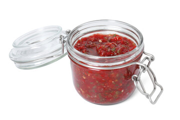 Tasty salsa sauce in jar isolated on white