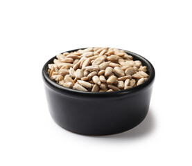 Sunflower seeds in bowl isolated on white
