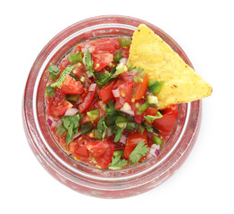 Tasty salsa in jar and nacho isolated on white, top view