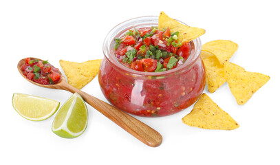 Tasty salsa in jar, lime and nachos isolated on white