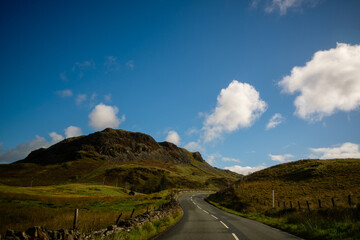 Winding Road Leading Toward Rocky Mountain in Snowdonia, Wales