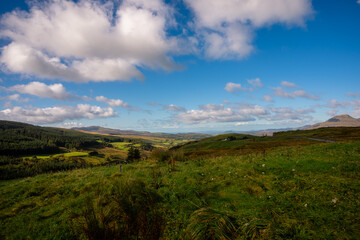 Wide View of Green Valleys and Distant Peaks Under Bright Sky in Snowdonia, Wales