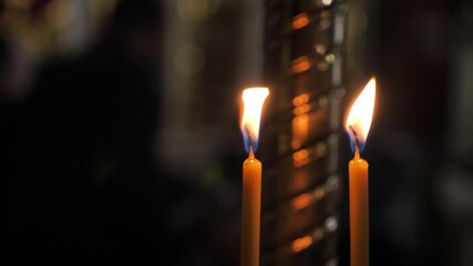 Burning candles in a church. A symbol of religion, prayer, and God. Remembrance Day in a church - Powered by Adobe
