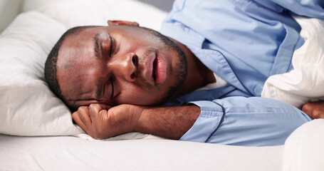 Exhausted African-American Carpenter Napping
