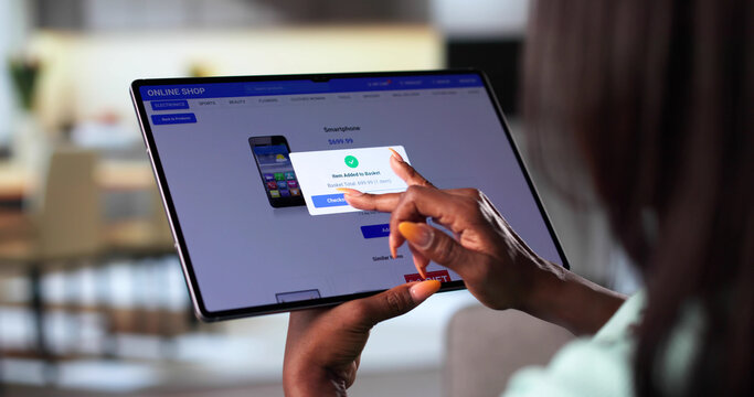 African American Woman Using Tablet Computer - Powered by Adobe
