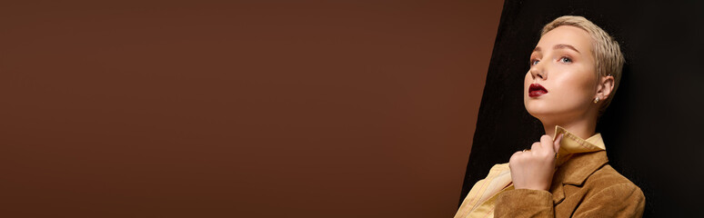 Stylish young woman exuding confidence in a modern fashion setting with rich earth tones