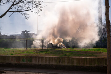 Fototapeta premium Burning Trash Near Stadium in Durres