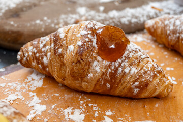 Sicilian desserts, sweets, cakes with ricotta cream, fruits, pistachio, on display in confectionery artisan shop