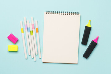 Drawing album and watercolor paints.