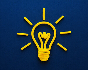 Inspiring yellow lightbulb shines, representing innovation and bright ideas for a creative concept, embodying energy and forward-thinking solutions