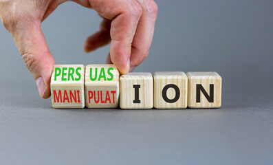 Persuasion or manipulation symbol. Concept words Persuasion and Manipulation on wooden cubes....